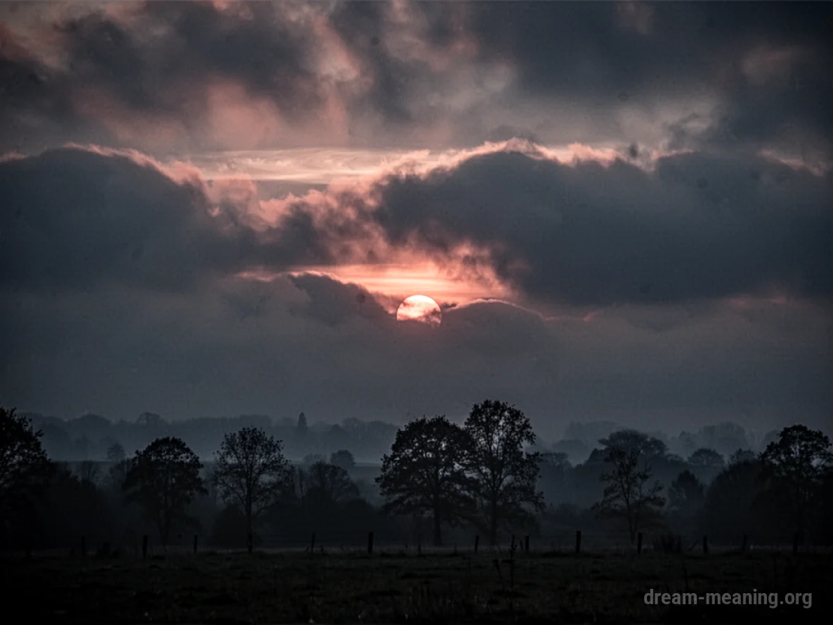 A dark, overcast sky with a hint of light struggling to break through.