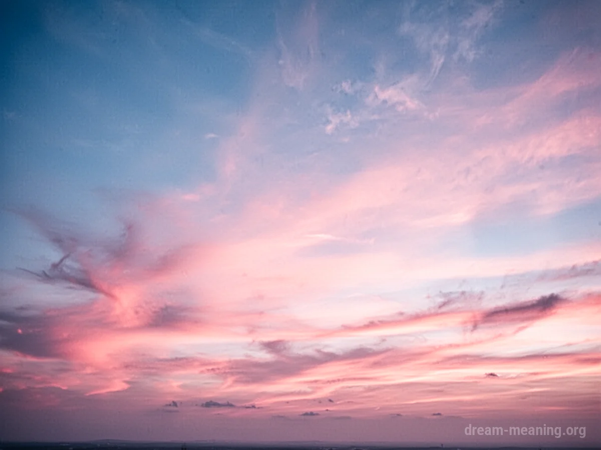A wide expanse of sky displaying a gradient of pink colors.