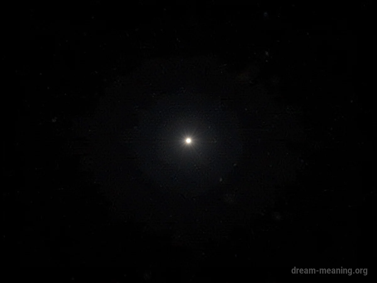 A tiny pinpoint of light in a vast expanse of blackness.
